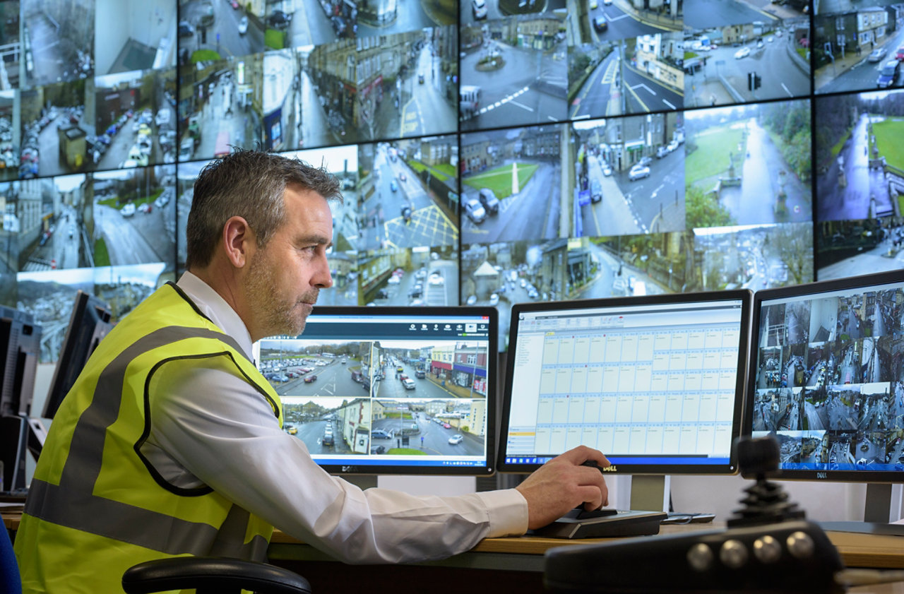 Security system operator in control room