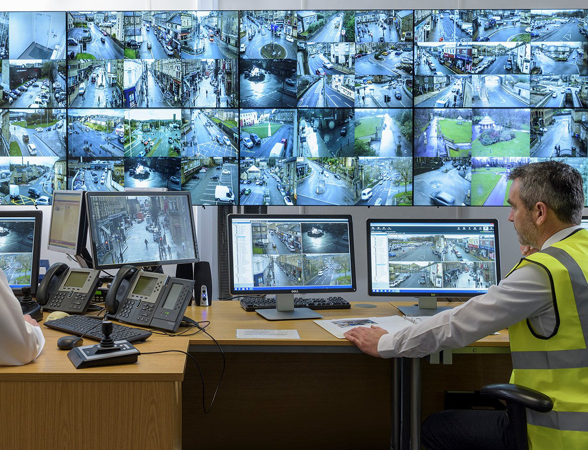 Security system operator looking at cctv footage