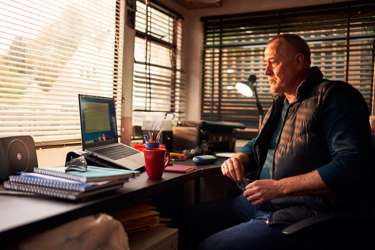 mature man at cabin desk