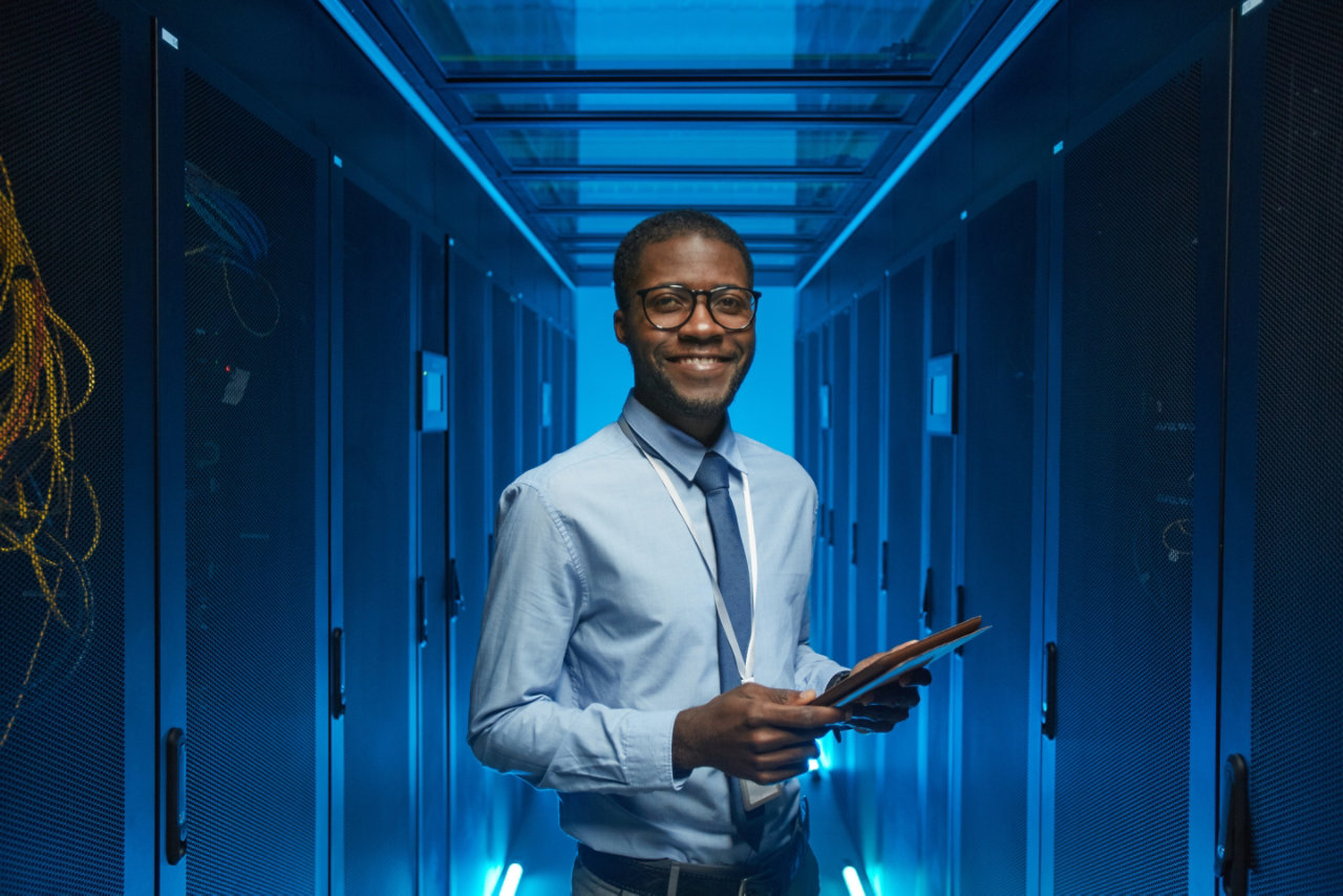 Employee standing in server room