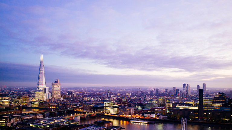 London city skyline looking south illuminated at sunset