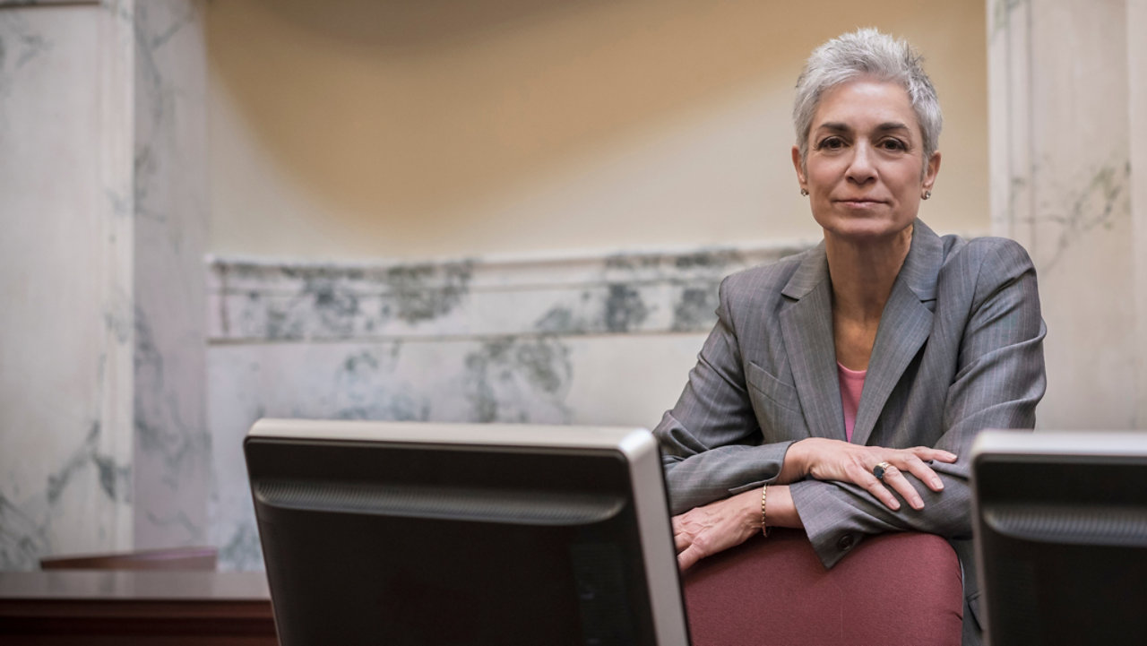 Mature woman sitting at a desk