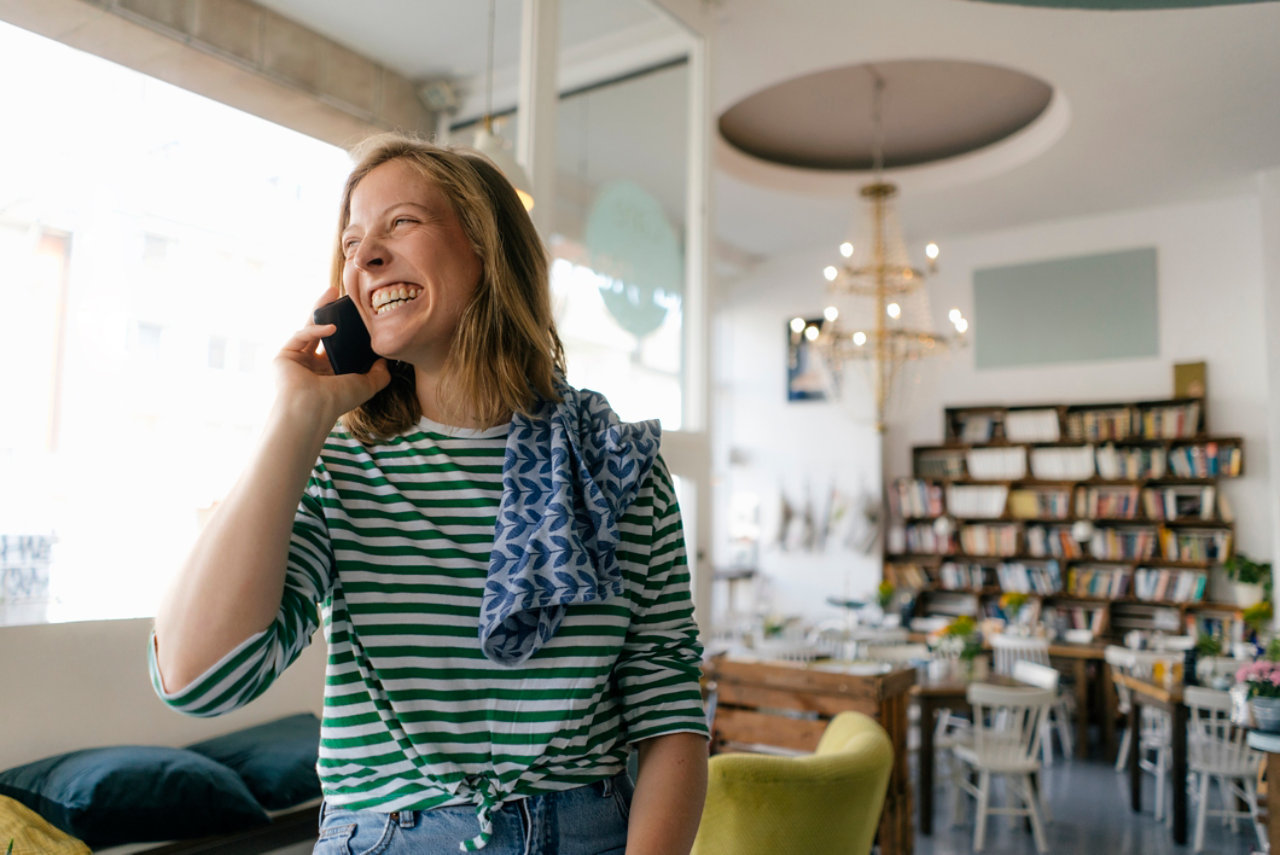 Woman talking on the phone. Use troubleshooting to fix phone line problems.