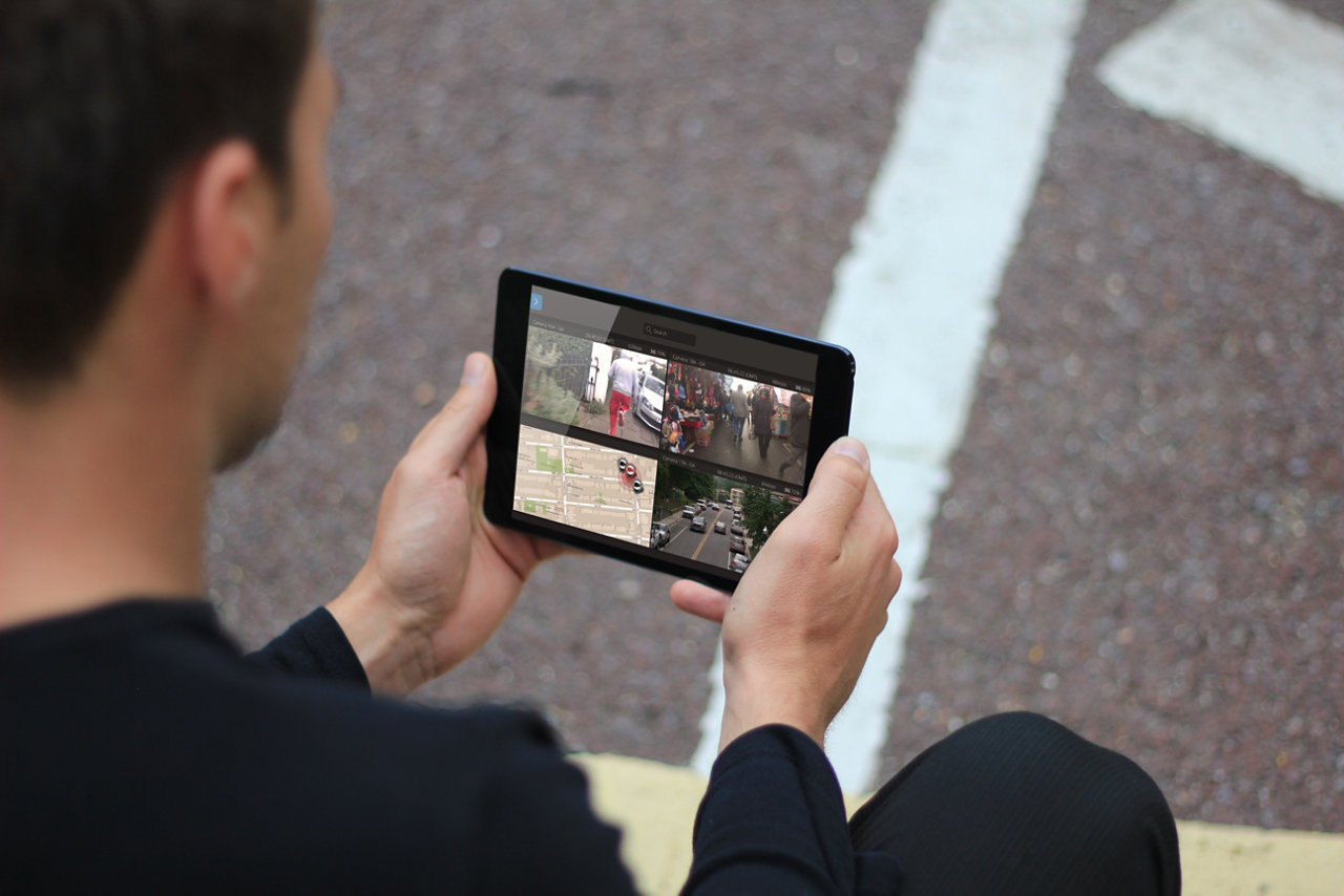Image of a man using mobile control camera view