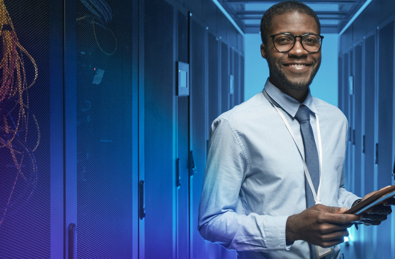 smiling man in data centre