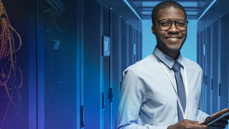 smiling man in data centre