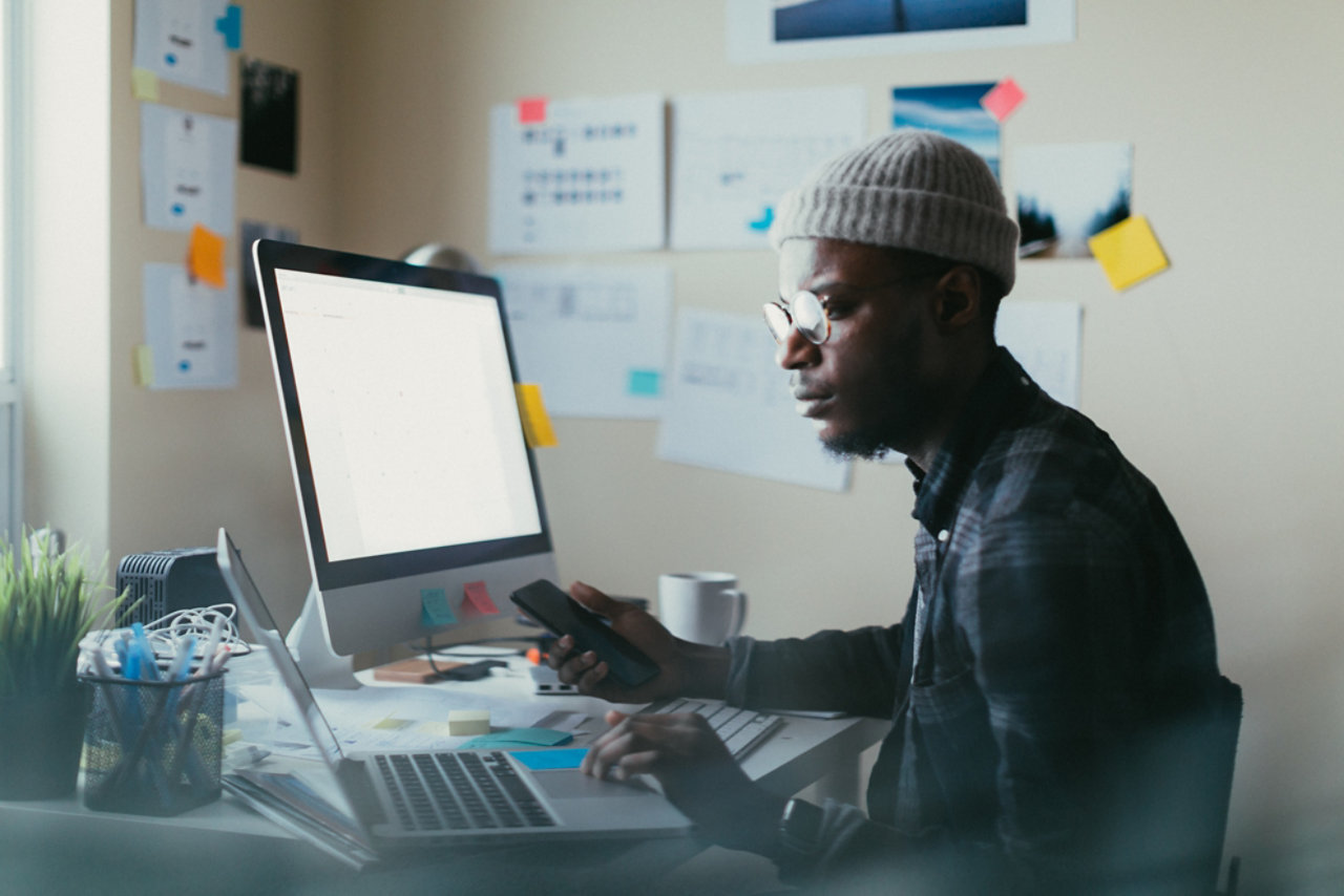 Trendy man using computer