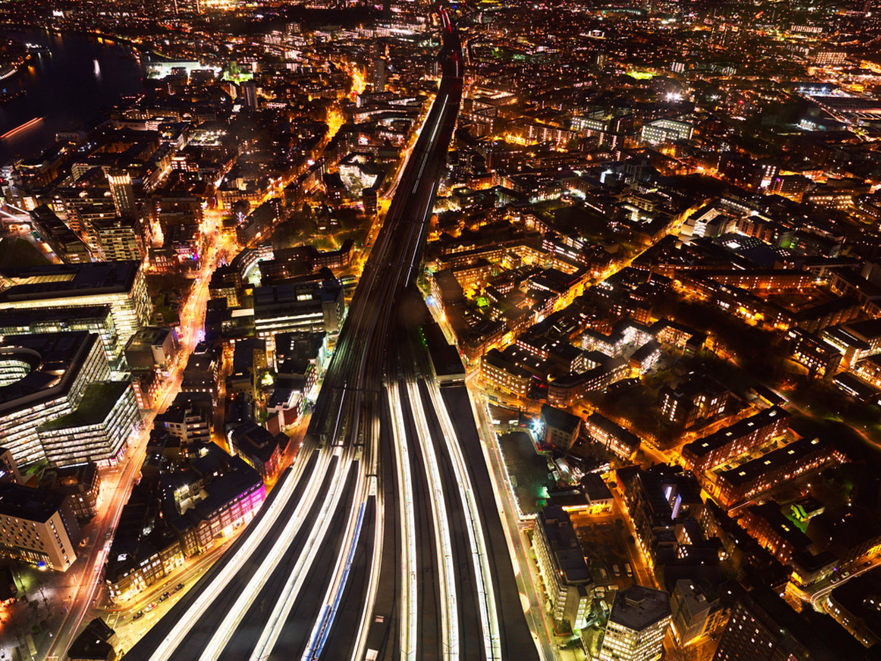 aerial view over london looking- east at night