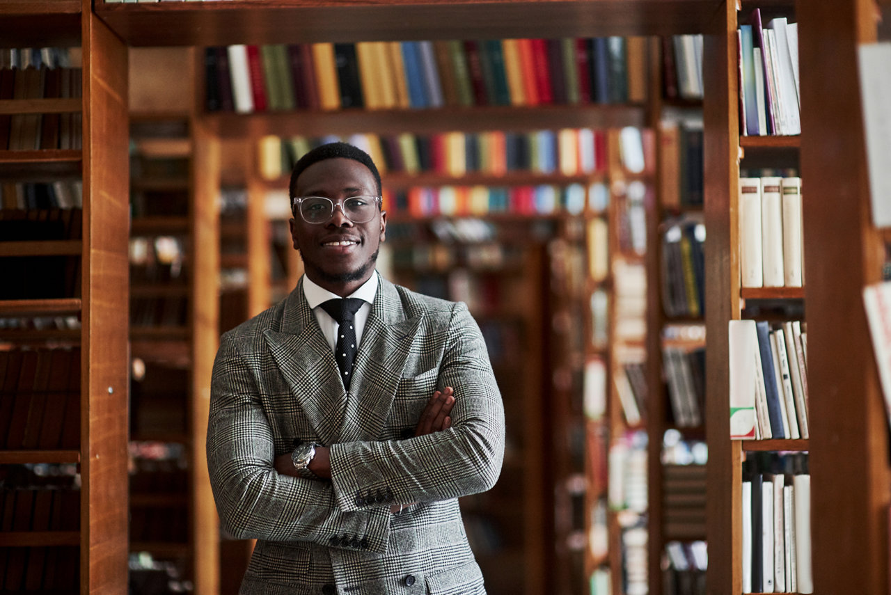 An african american man in a business suit in a library