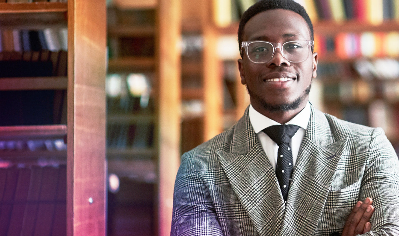 an african american man in a business suit in a library