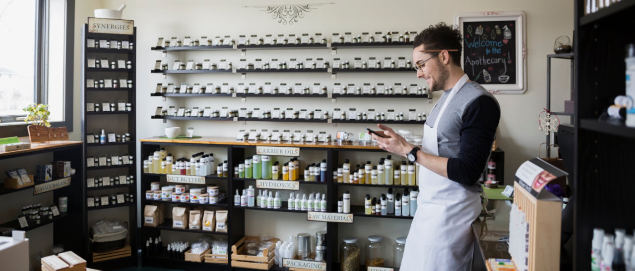 Shop owner using the BT Business app on their mobile.
