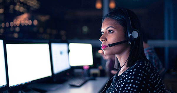 Woman in office on phone call