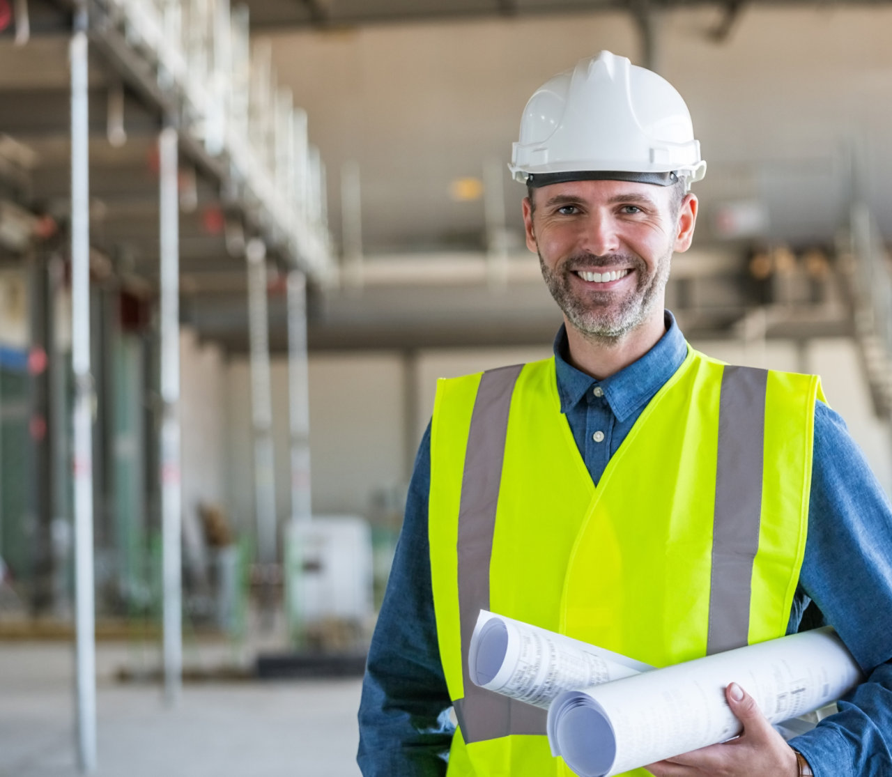 Young engineer piloting drone at power plant