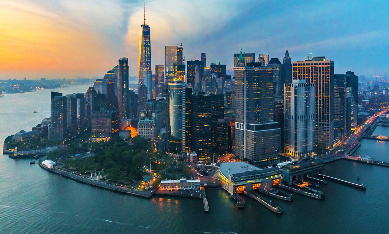 twilight view of city buildings near waterfront