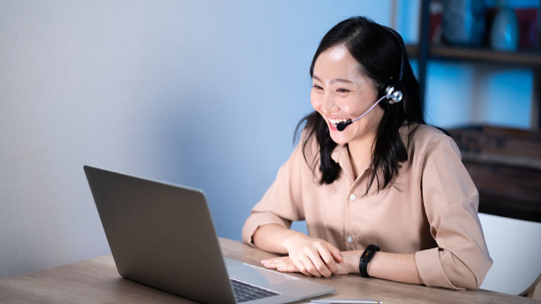 Asian female customer care service smiling