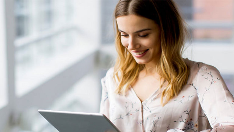 autonomous customer working at laptop