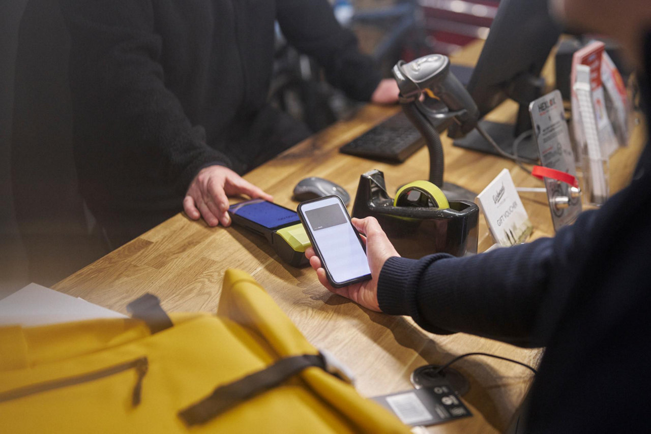 lady in a navy suit looking at her business mobile phone