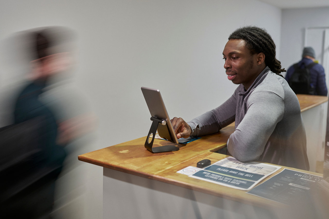 Small business owner talking with customer