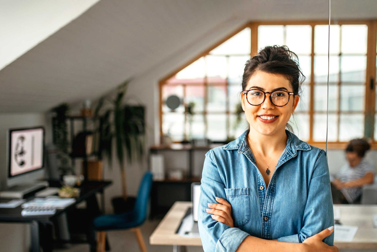 A small business owner standing in her studio office