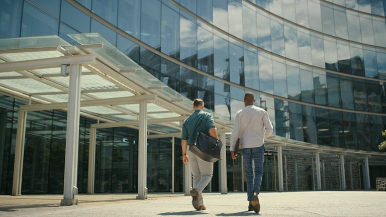 business people travelling to work building in the morning