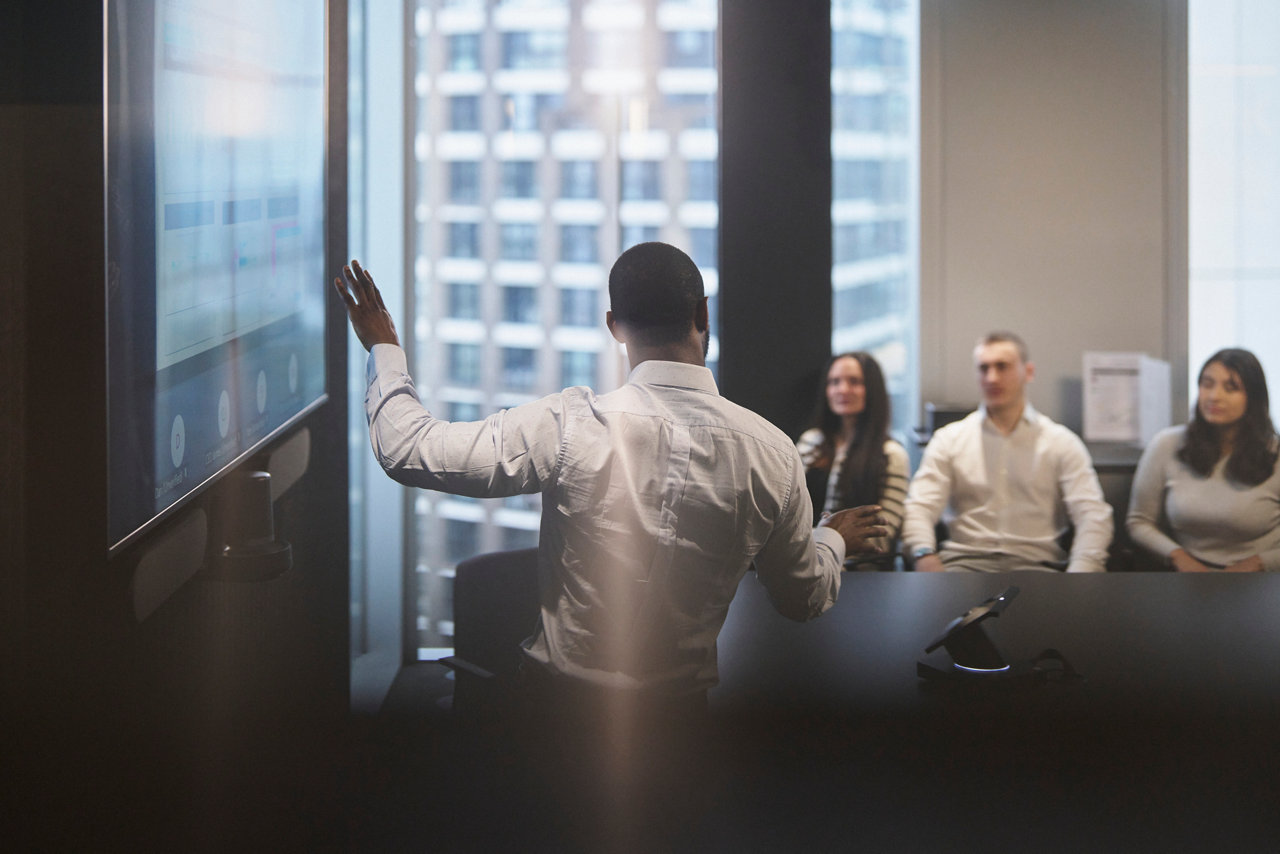 business people watching a presentation in the fofice