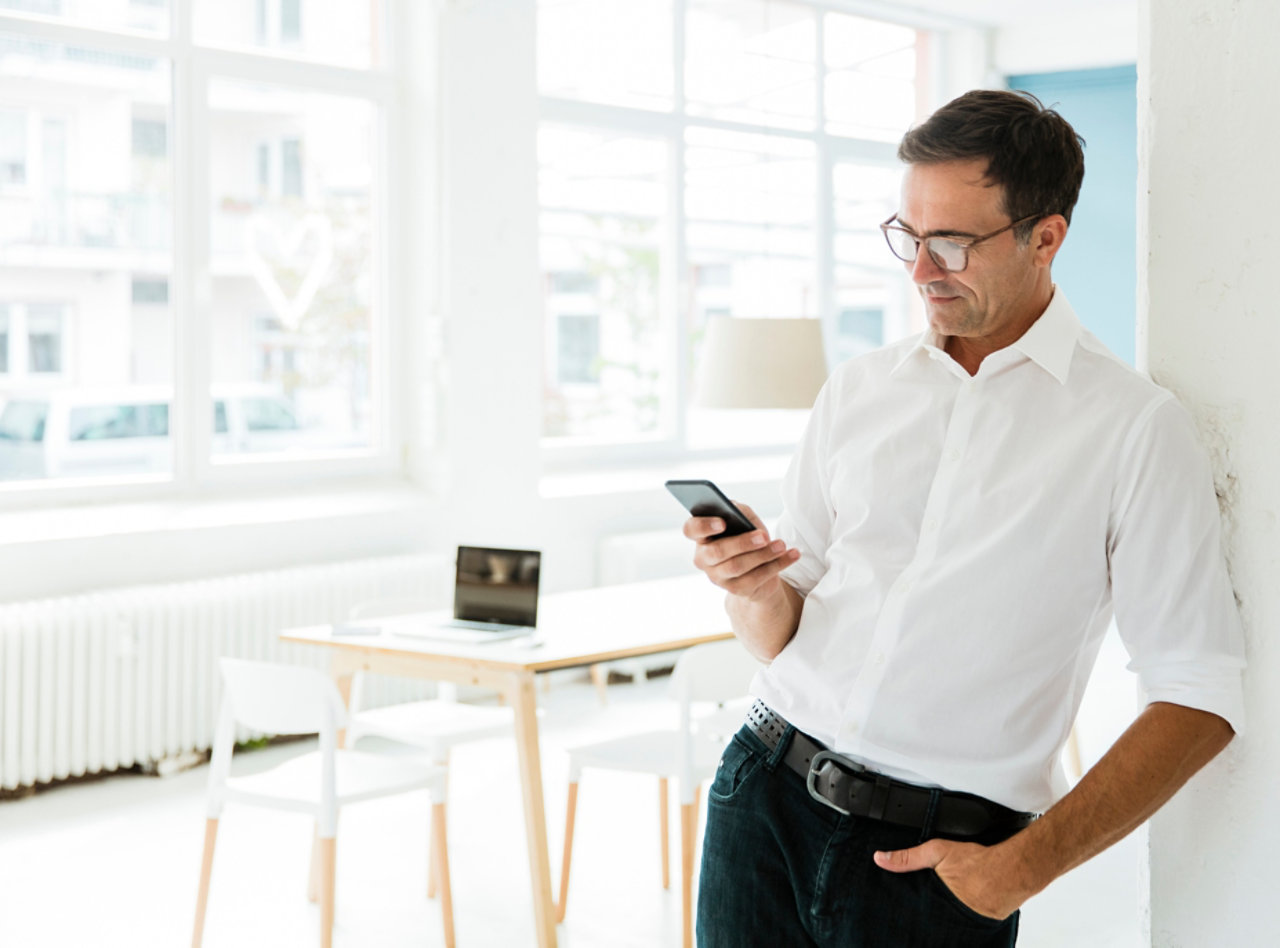 businessman-looking-on-cell-phone