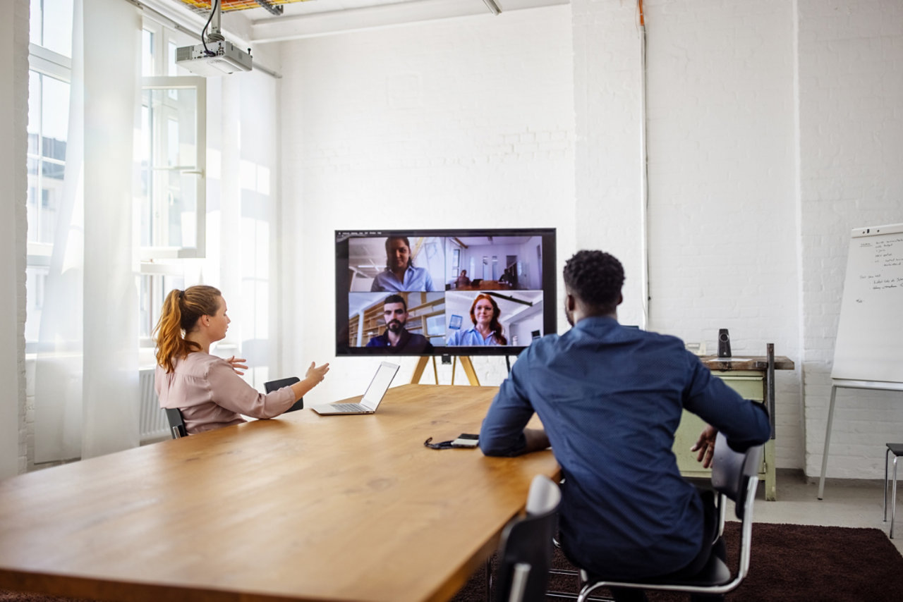 Business people having a video conference in office