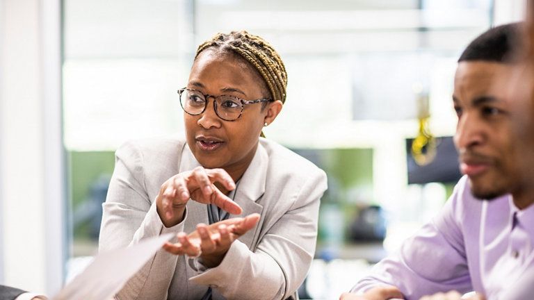 Businesswoman leading office discussion