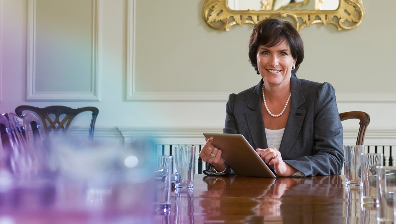 businesswoman sitting at meeting table