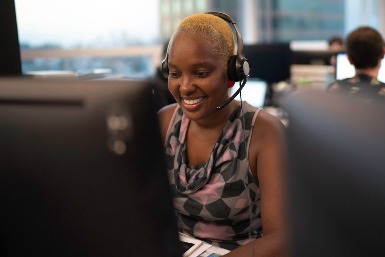 woman in headset working in office