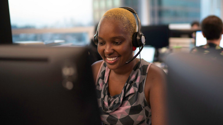 woman in headset working in office