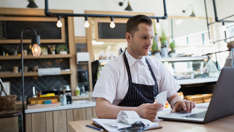 cafe owner inputting receipts