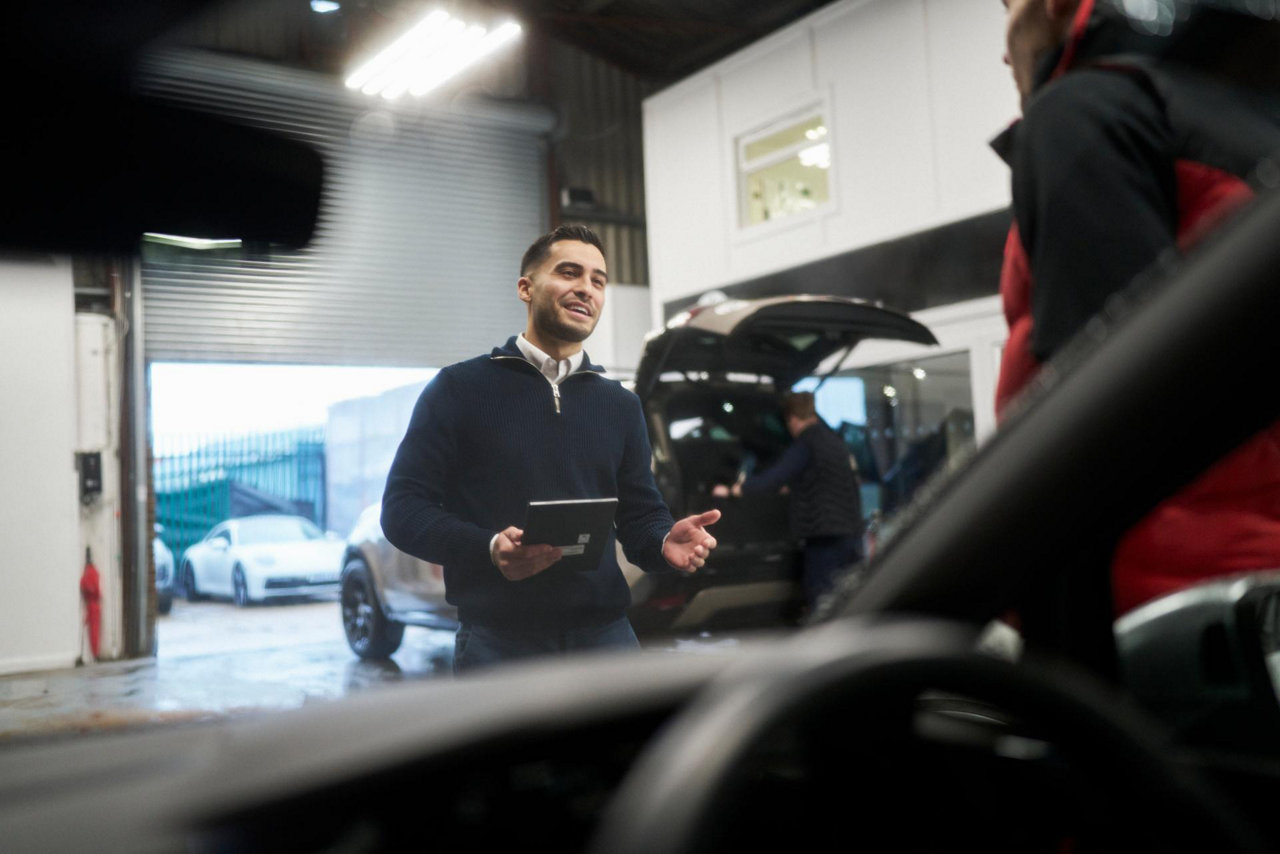 car dealer speaking to customer