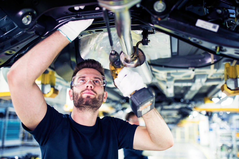 man working on car