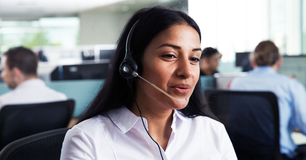 woman in contact centre wearing headset
