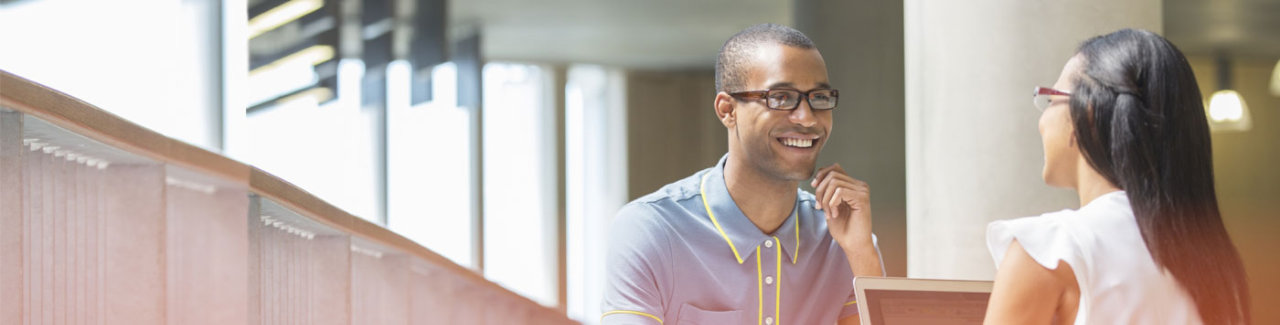 man and woman smiling and talking