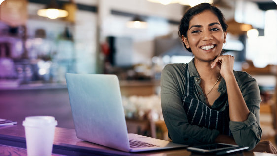 Global customer working remotely in a coffee shop.