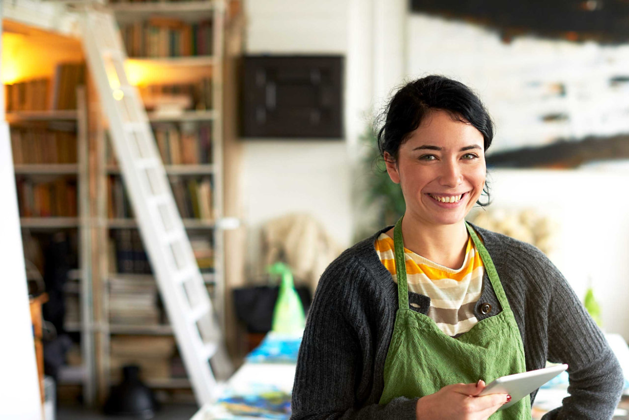 Female small business owner wearing an apron