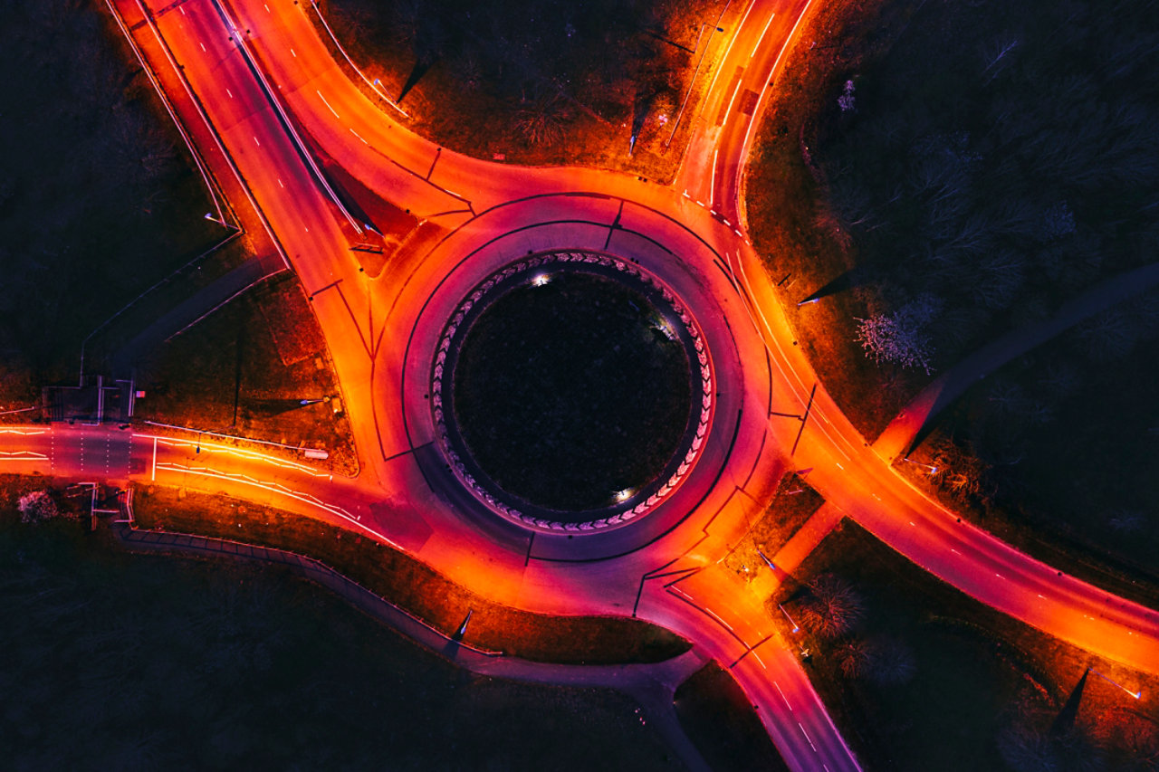 Drone view of a roundabout illuminated at night