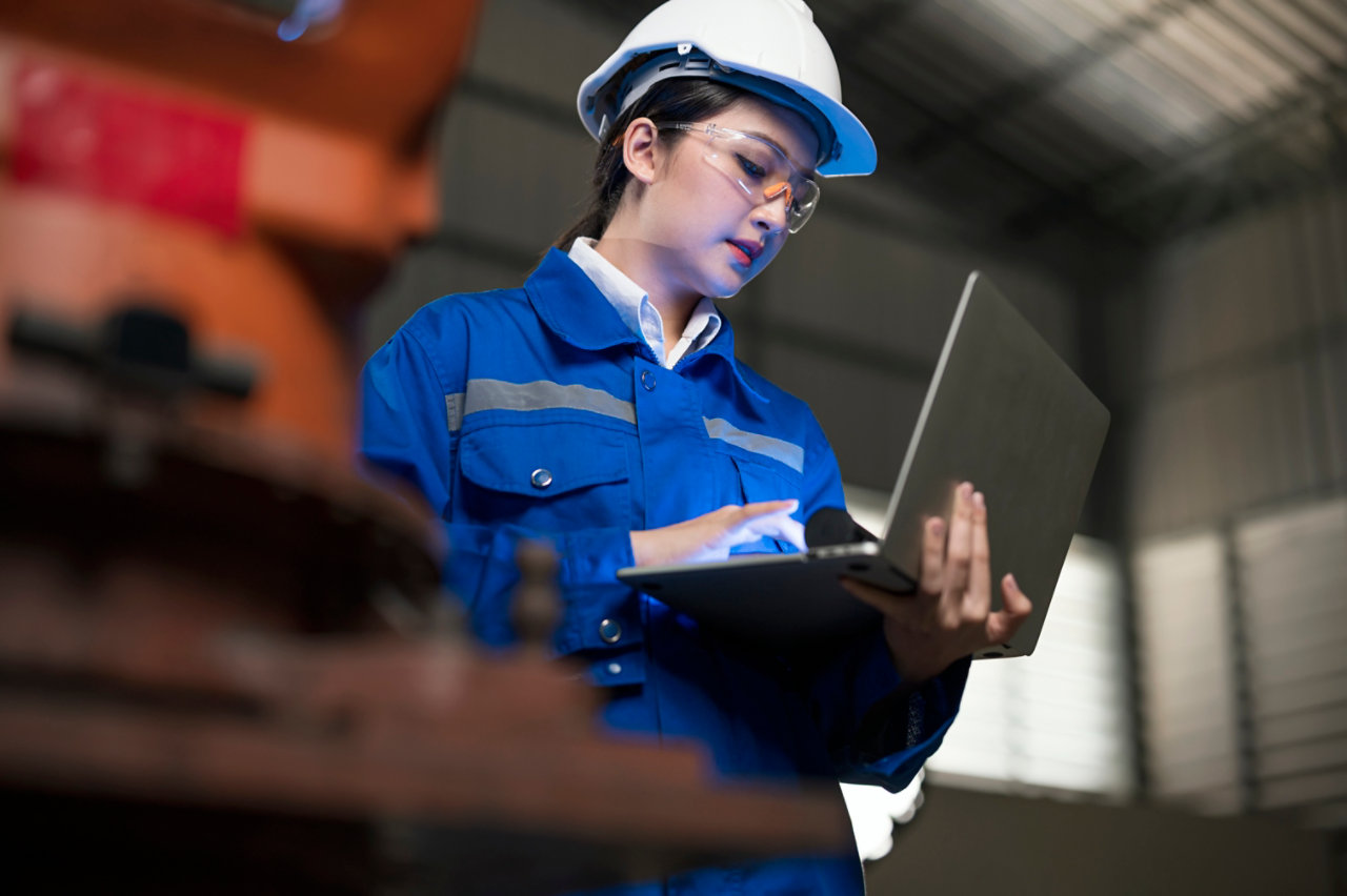 Female engineer working at a factory