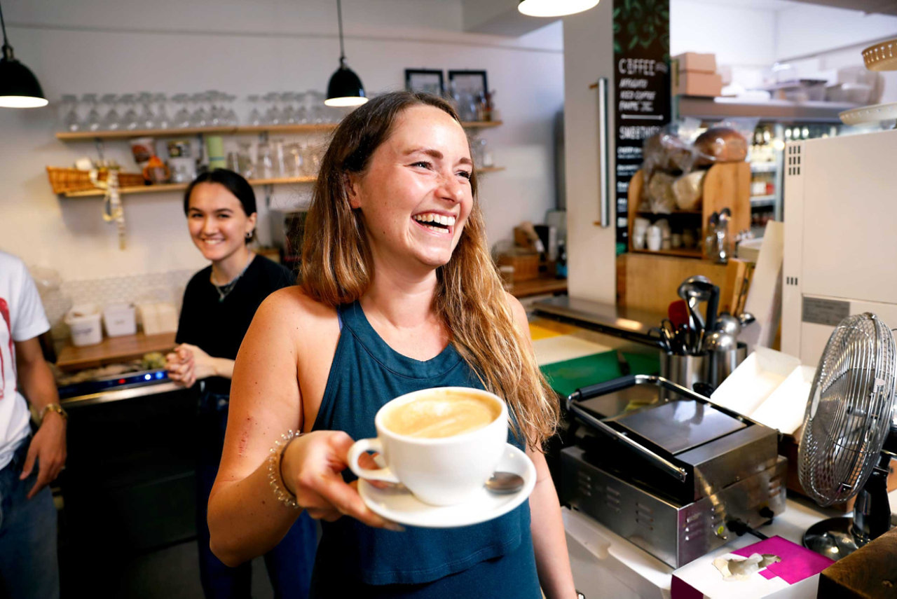 coffee-shop-employee-serving-a-customer