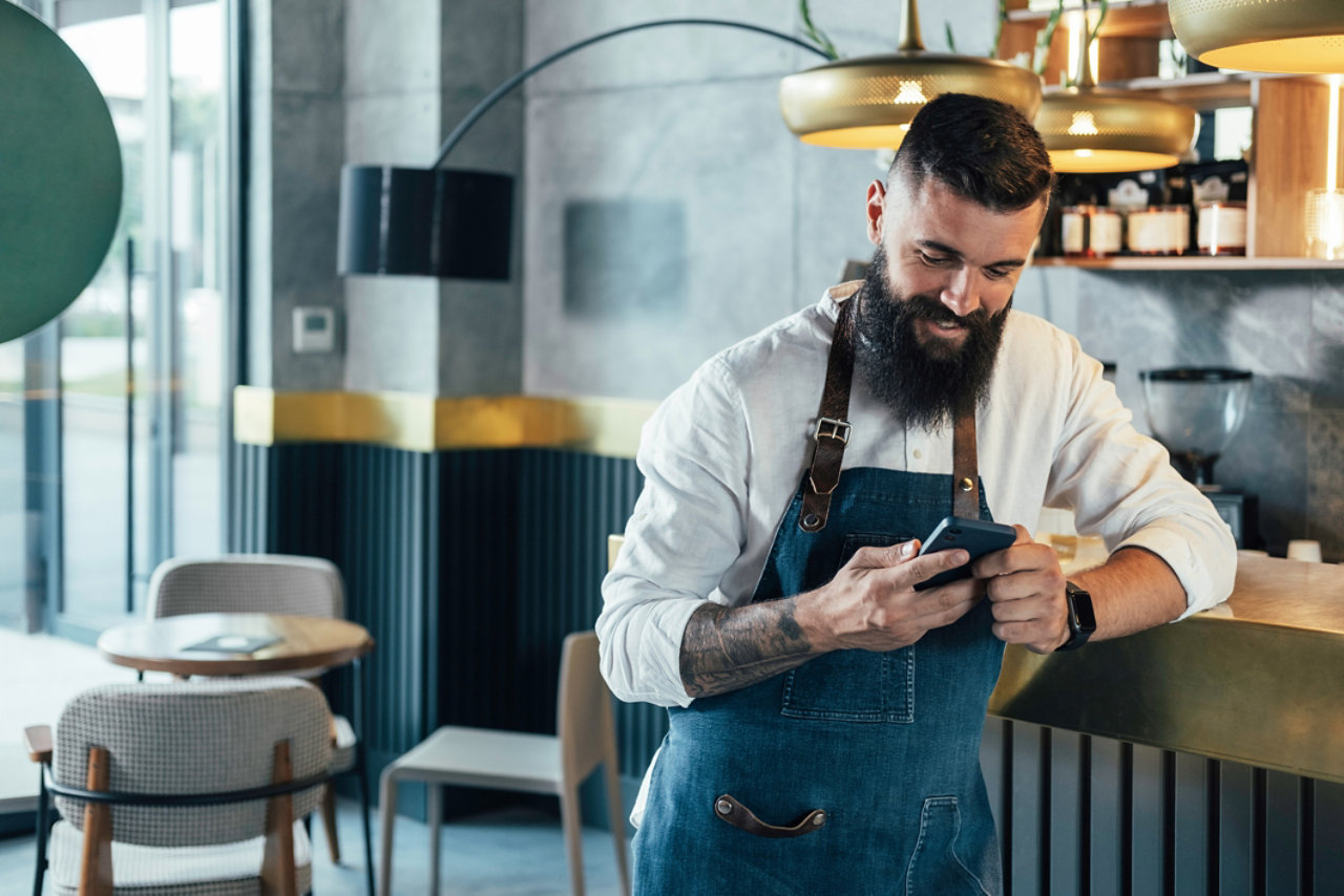 small business owner checking out their mobile device