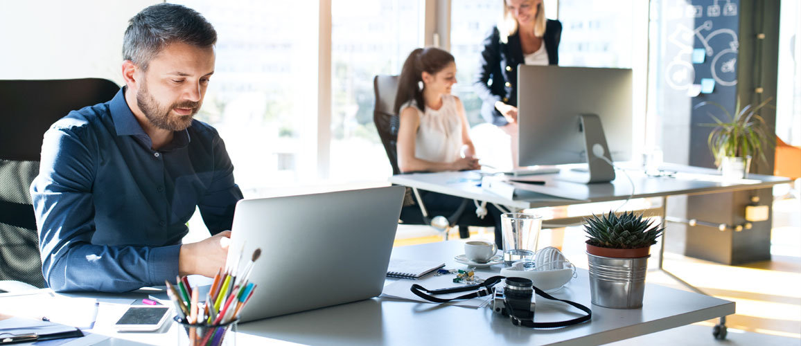 people working in a office in a hybrid environment