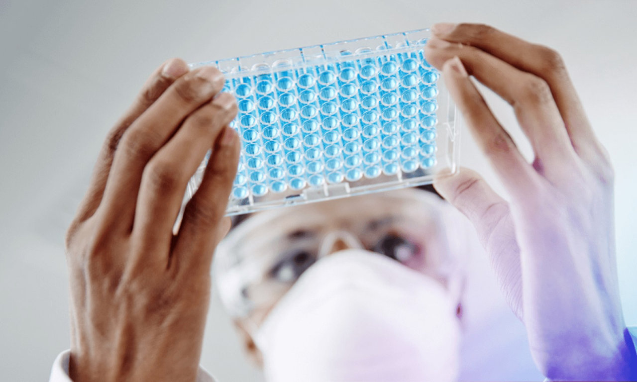 man holding petri sample dish