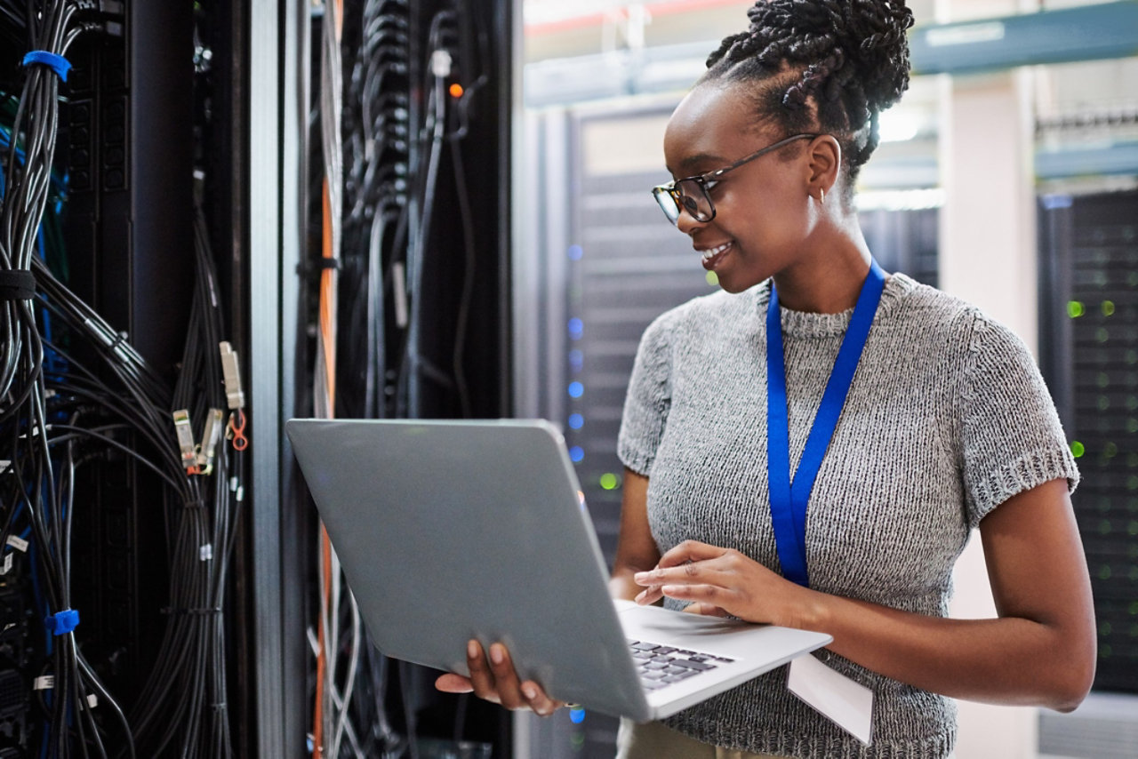 Smiling lady checking a network for faults and repairs