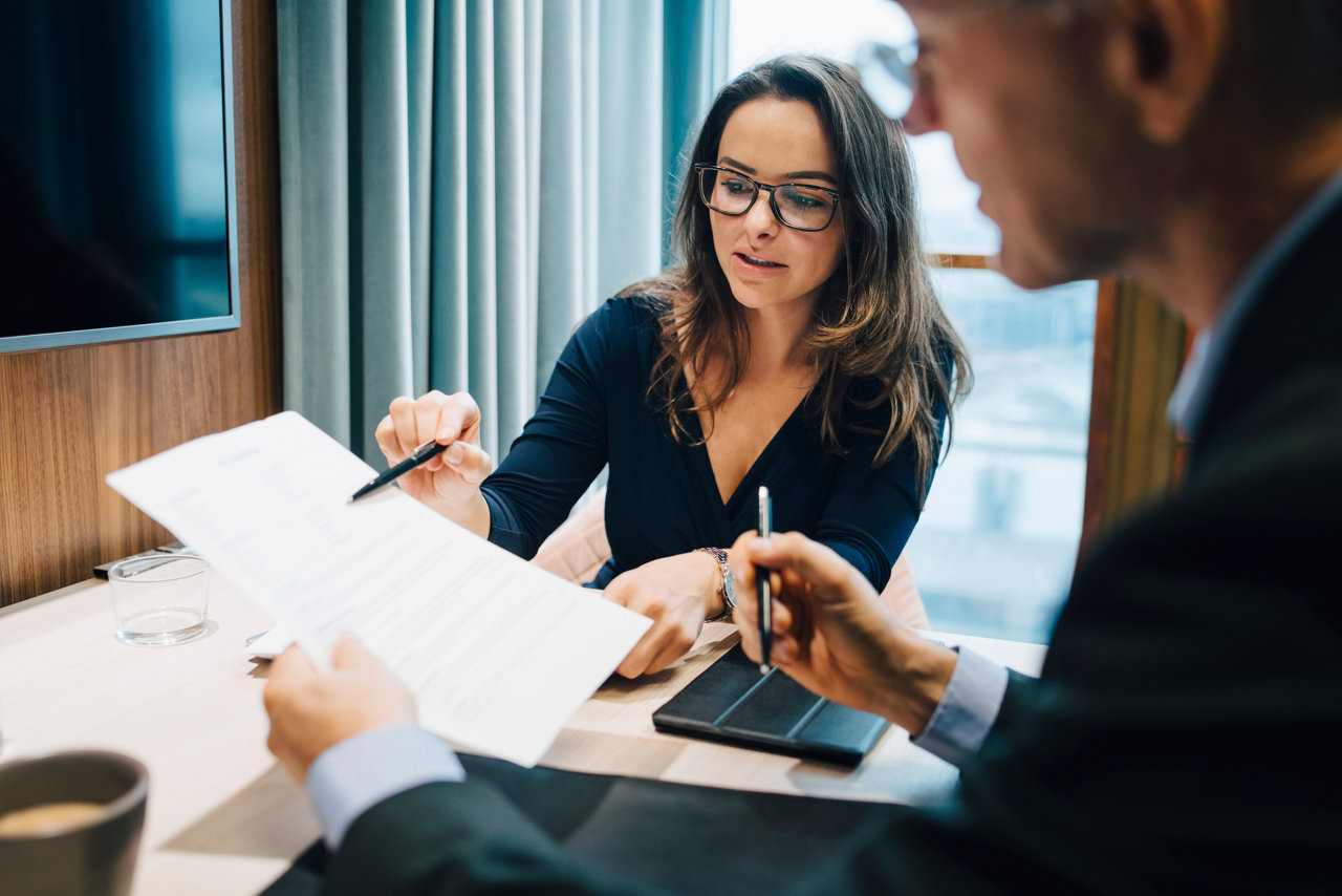 Two people working on paperwork