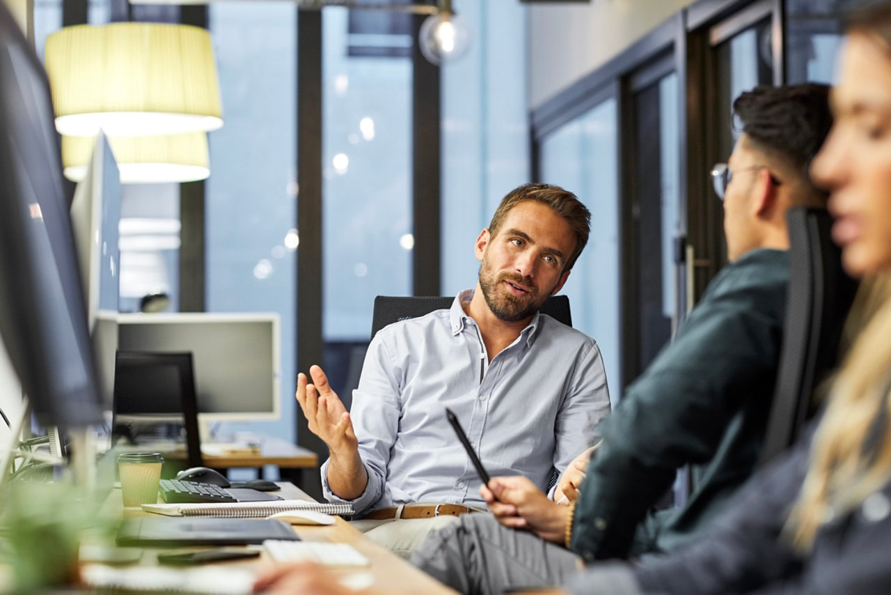 corporate business owners discussing mobile devices