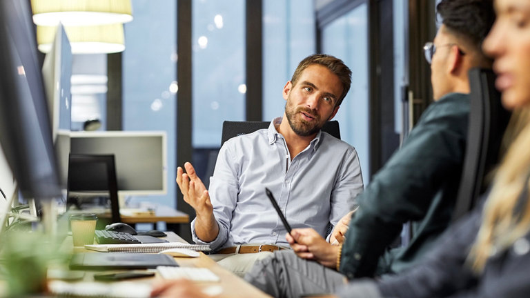 male coworkers discussing