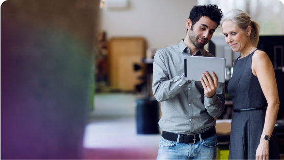 Couple working remotely on their tablet.