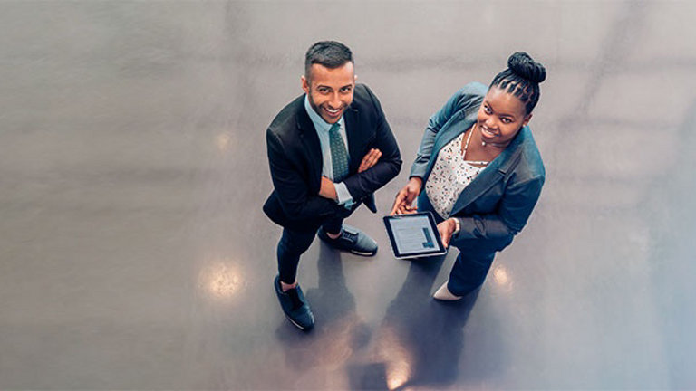 man and woman with tablet